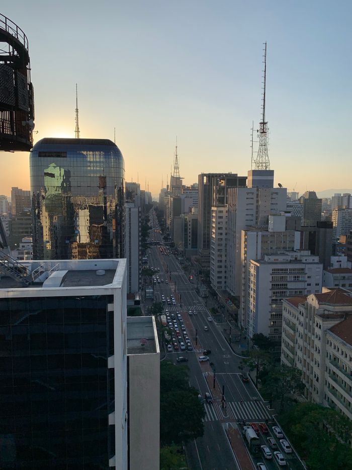Stunning aerial cityscape of Sao Paulo, Brazil, showcasing skyscrapers and urban streets at dusk.